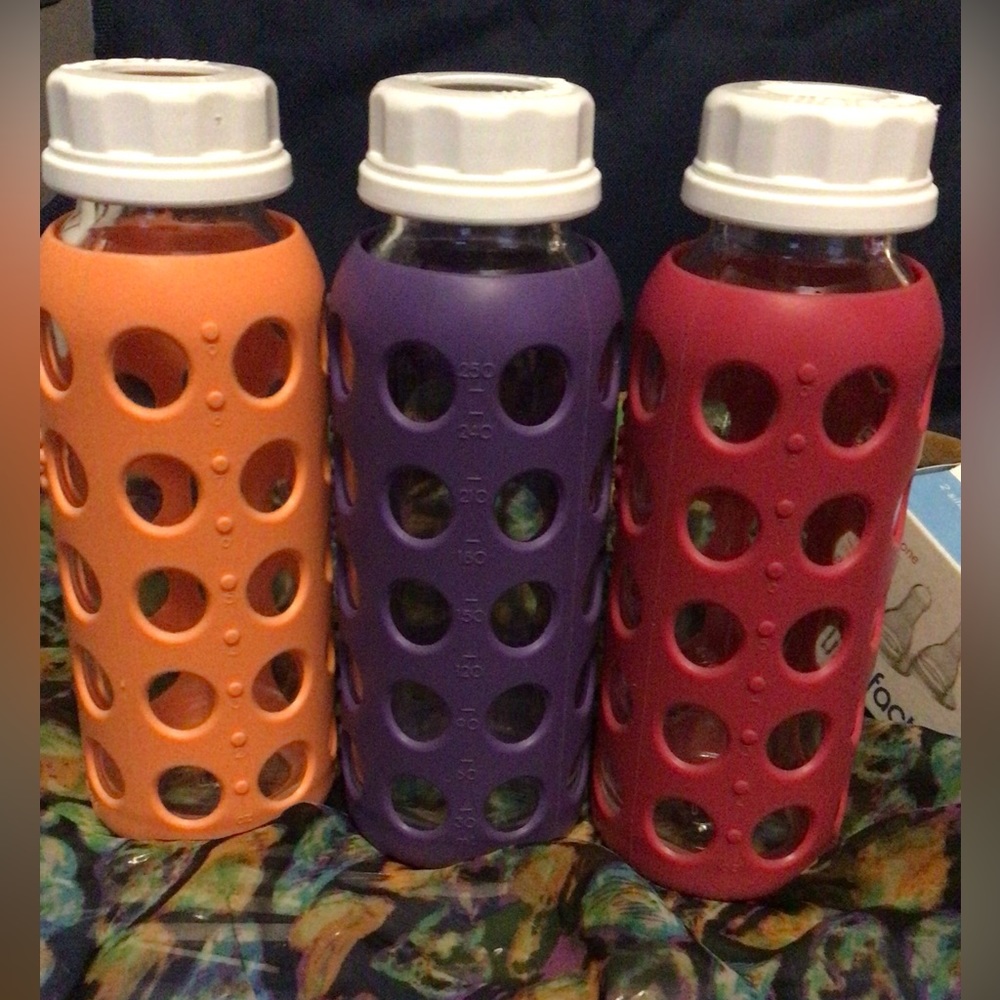 Three 9oz LifeFactory glass baby bottles with protective sleeve & 2 new nipples